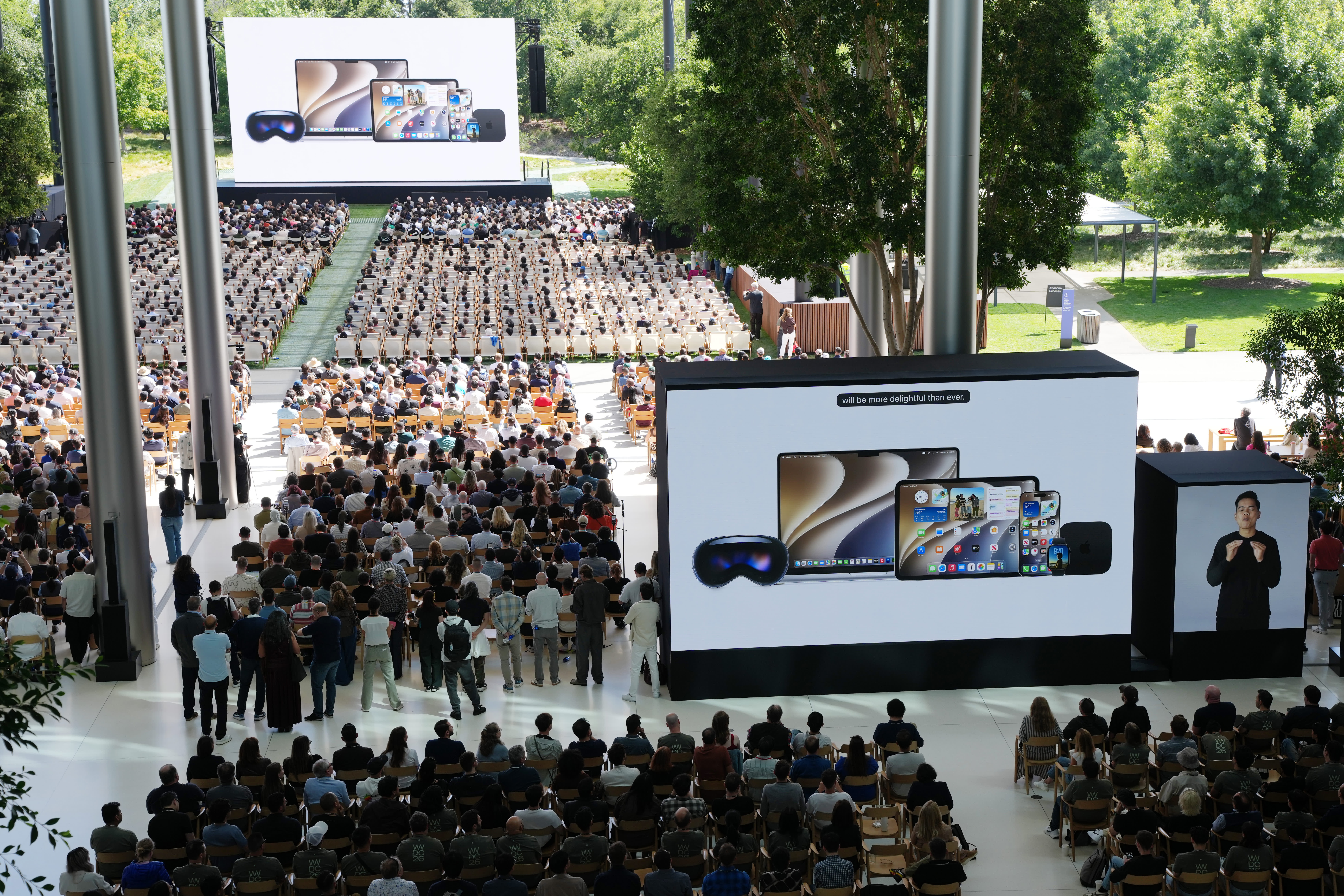 Tim Cook on the WWDC 2026 keynote stage in front of a Siri AI title card