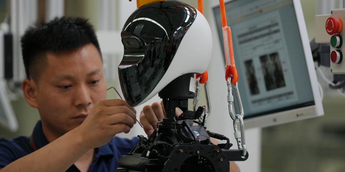 A Chinese-built humanoid robot on a factory floor, one of thousands now shipping faster than buyers materialize